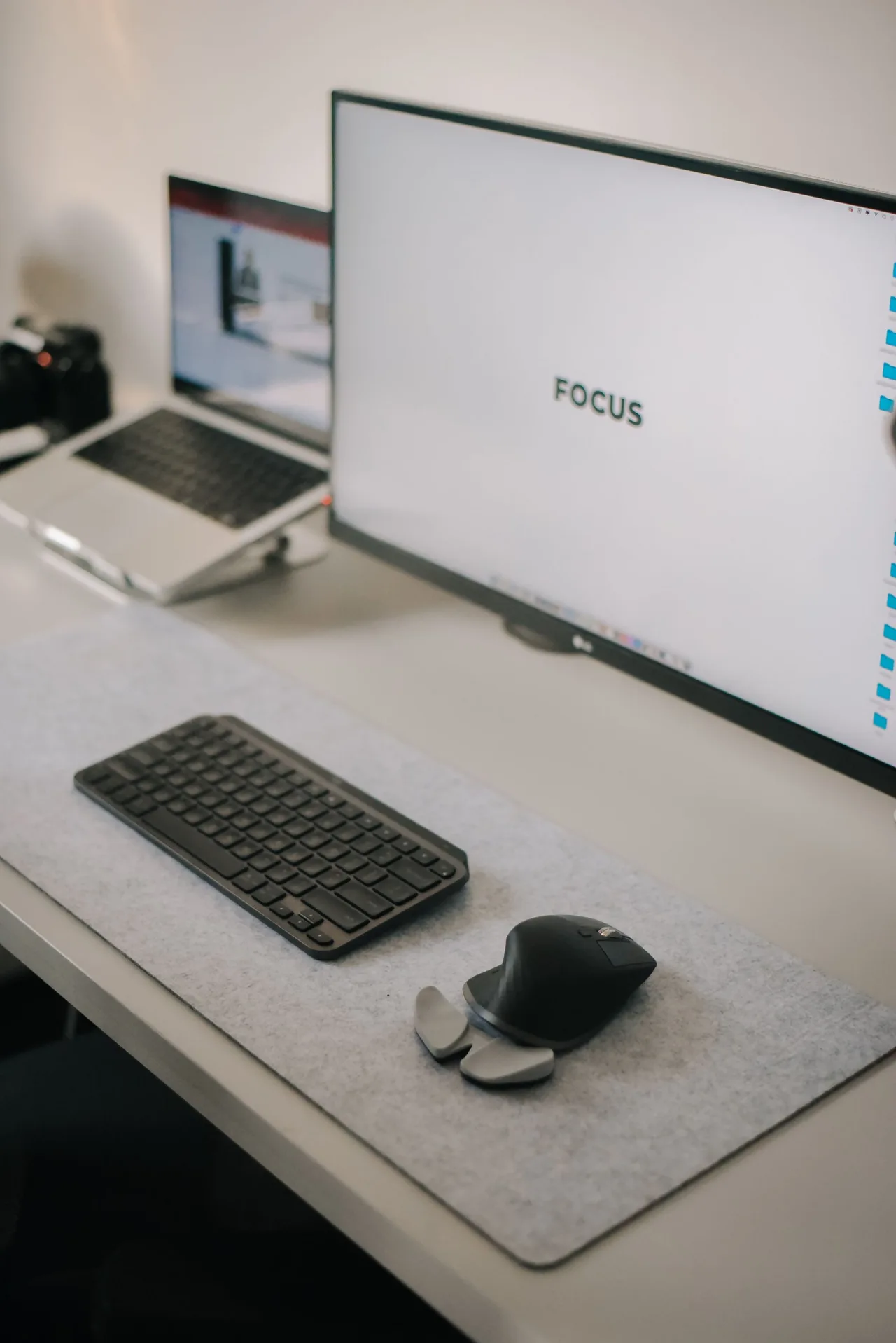 A desk setup with two monitors and a keyboard