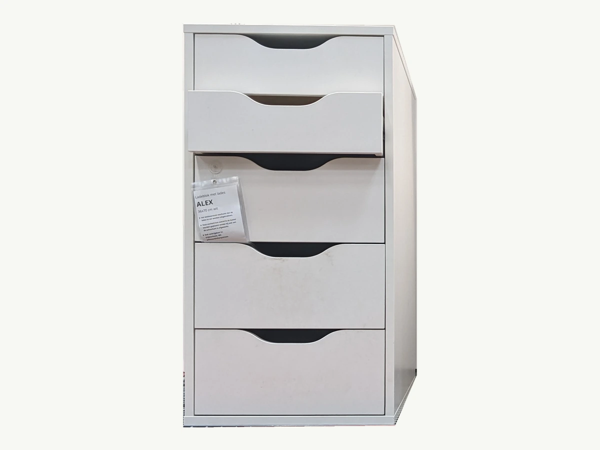 Actual white IKEA ALEX drawer units in a store display; standard unit on left