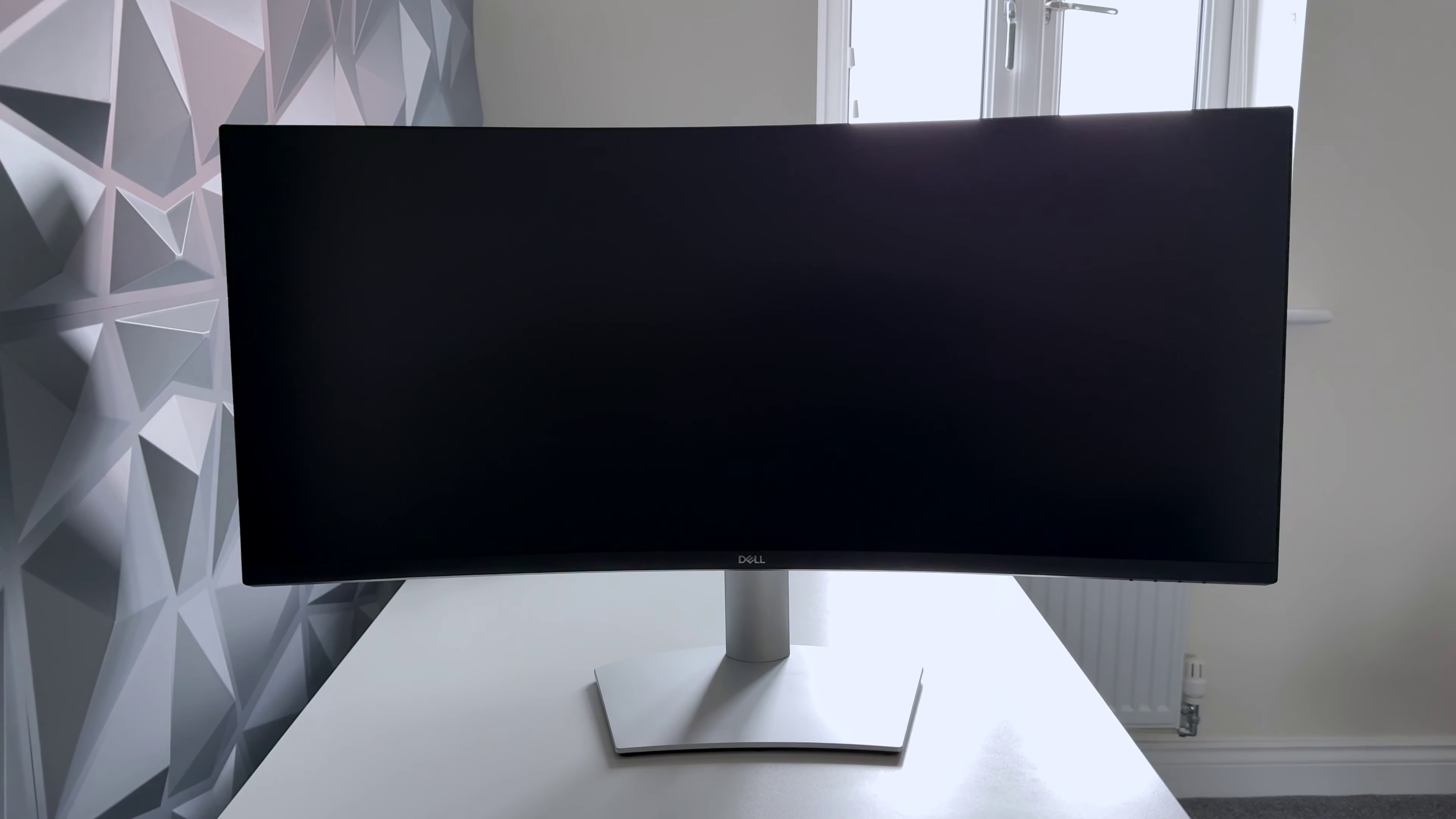 Actual Dell S3423DWC with silver stand and black front, primary