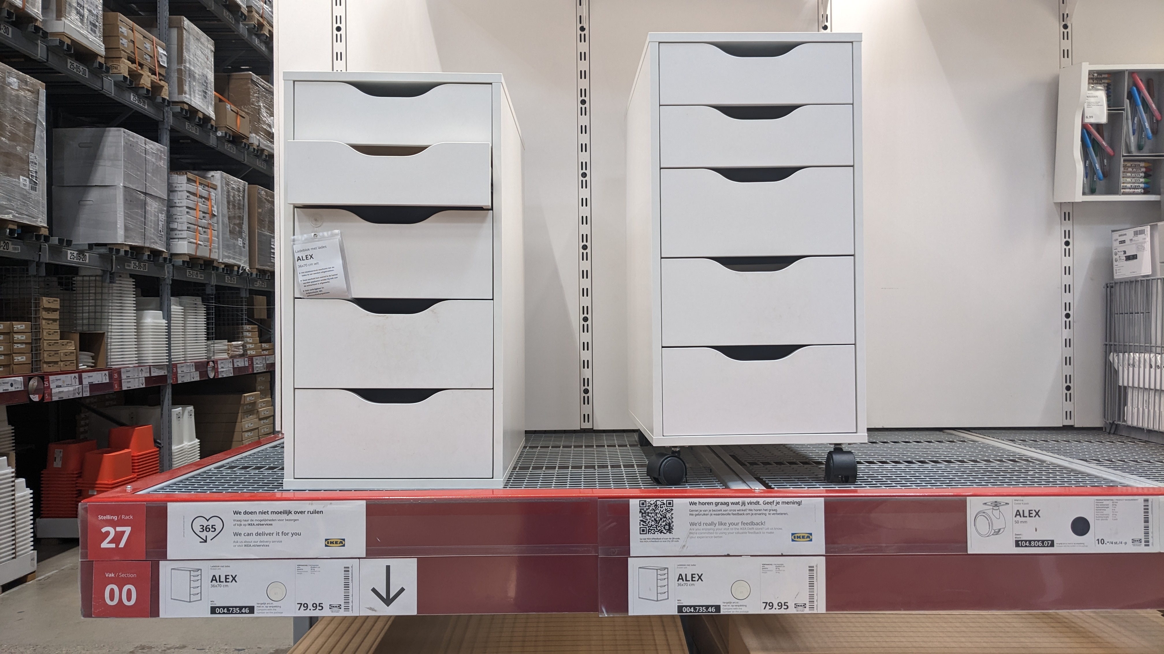 Actual white IKEA ALEX drawer units in a store display; standard unit on left