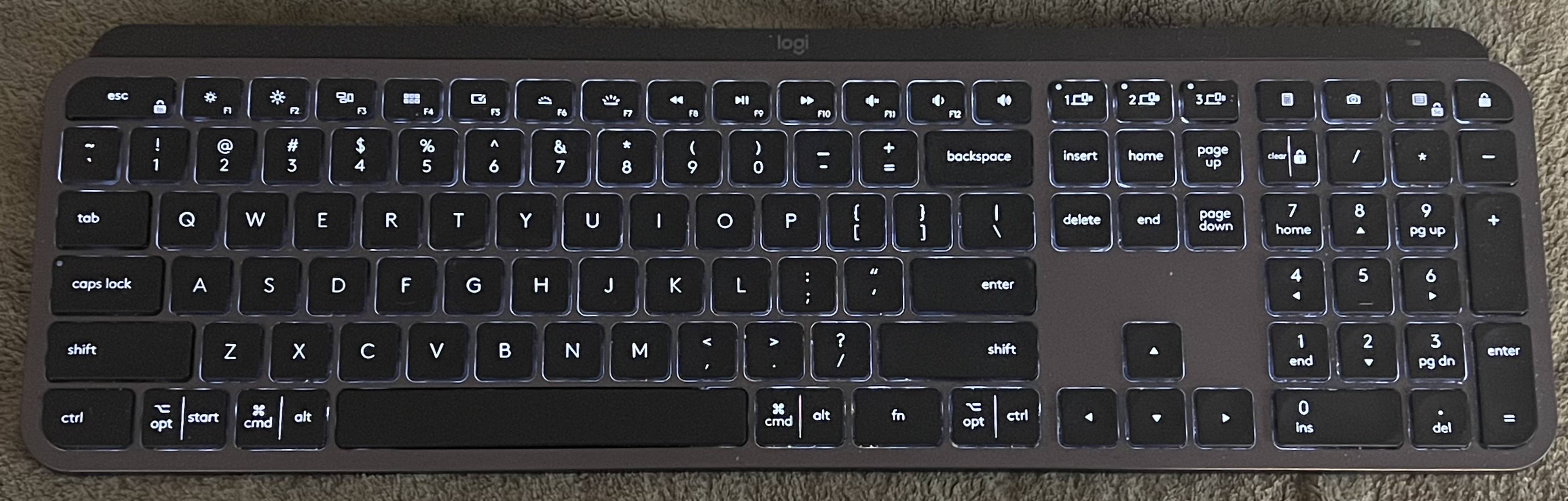 Original Logitech MX Keys keyboard in graphite with visible US multi-OS layout and number pad